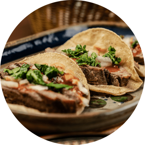 two tacos on a plate on a table