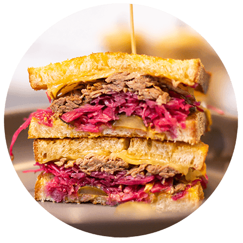a sandwich cut in half on a white plate