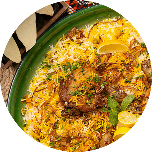 a plate of food with rice and meat on a green plate