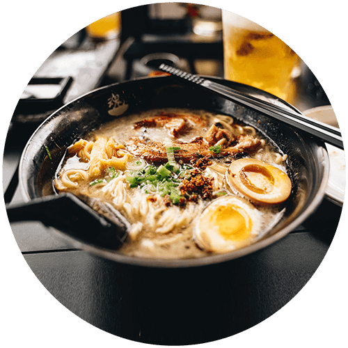 a bowl of ramen with eggs and noodles