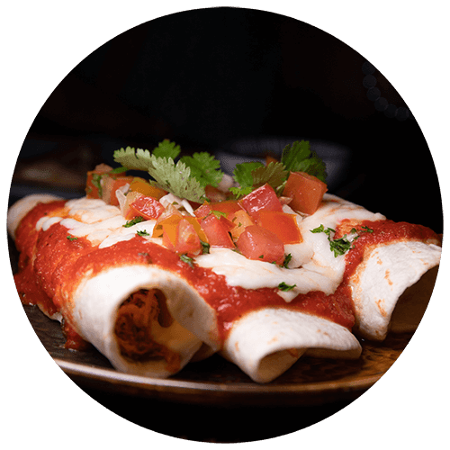 a plate of food with tacos and salsa on it