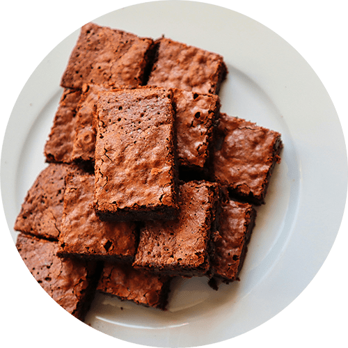 A plate of brownies on a white background.