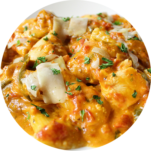 A plate of food with a creamy tomato sauce and garnished with herbs.
