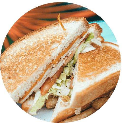 a sandwich is cut in half on a plate