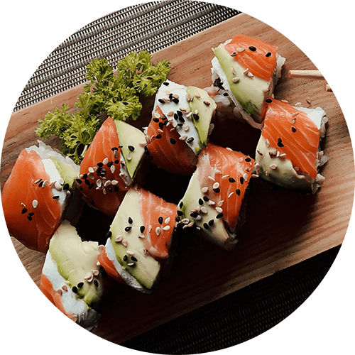 a wooden cutting board with different types of sushi