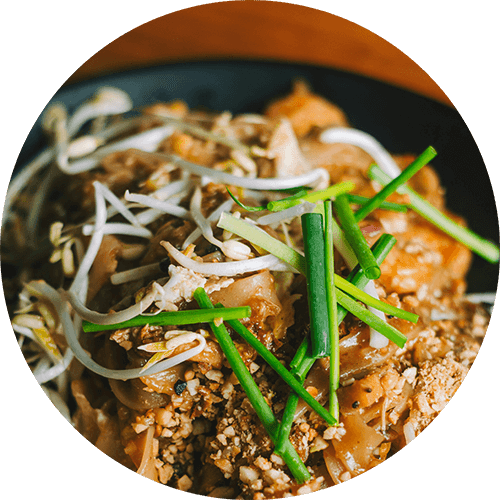 a close up of a bowl of food with rice and vegetables