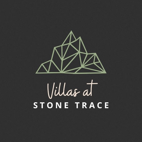 a logo with a mountain in the background