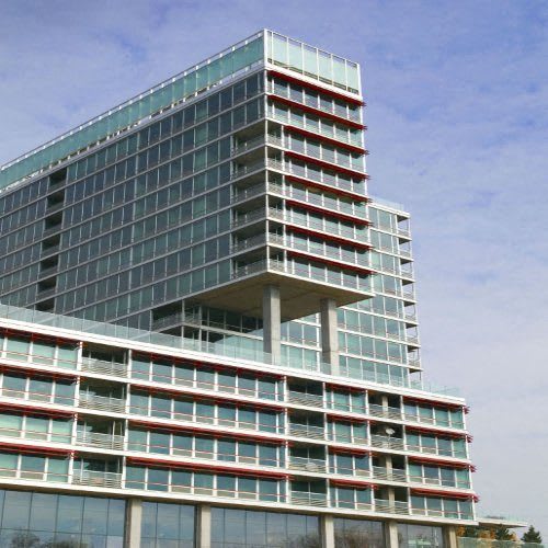 a tall building with a blue sky in the background