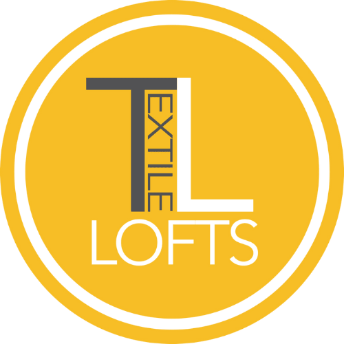A yellow circle with the letters "TL" and "LOFTS" written on it.