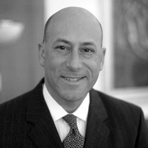a man in a suit and tie smiling