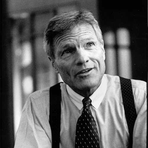 a man wearing suspenders and a tie