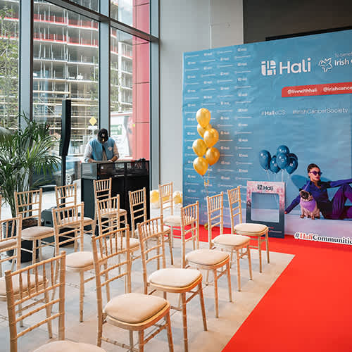 A room with chairs and a sign that says Hali.