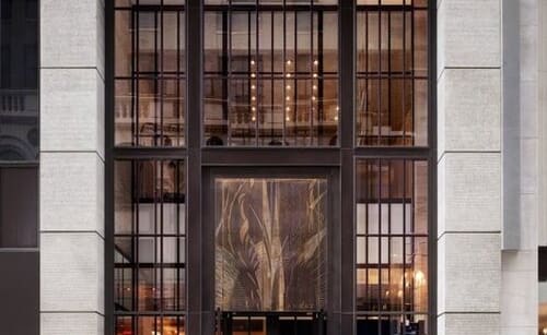a tall building with a large window and a door