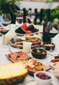 a table full of food and wine