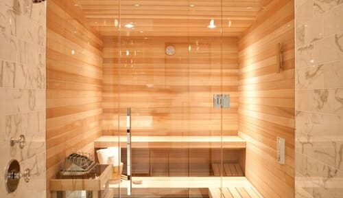 a sauna with wooden walls and floors
