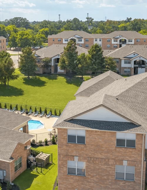 A residential area with houses and a pool.