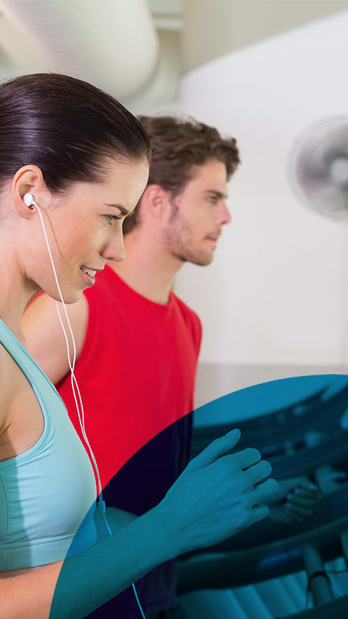 Two People in Fitness Clothing at Fitness Center