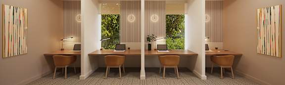 A room with four desks and two chairs.