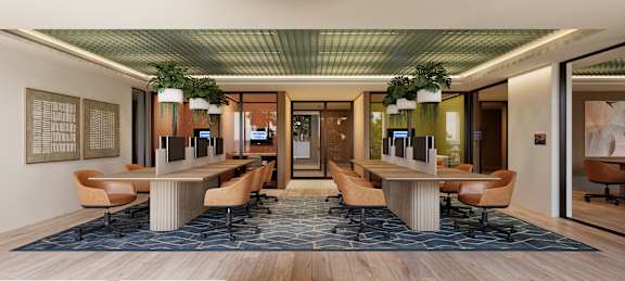 A conference room with a long table and chairs.