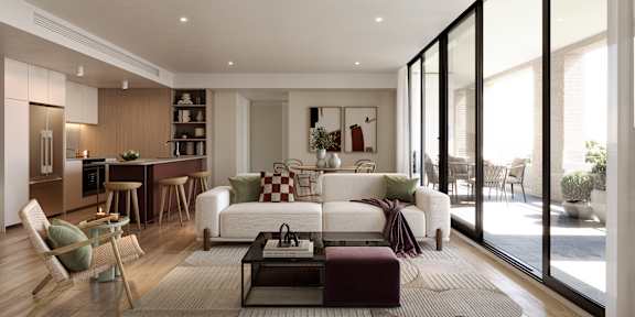 A modern living room with a white sofa and a coffee table.