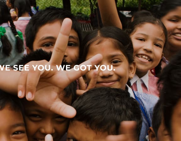 a group of children pose for a photo with the words we see you, we got you
