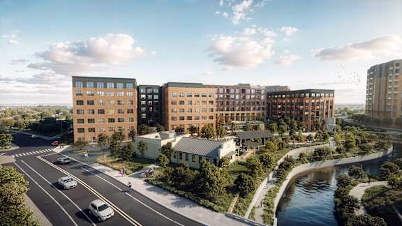 A modern urban development with a river running through it.