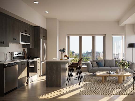 A modern kitchen with a dining area and a view of the city.