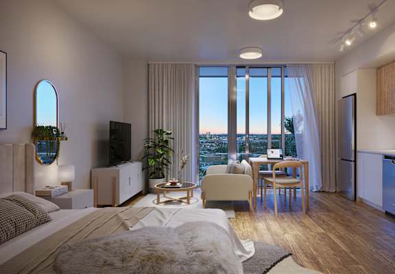 A modern bedroom with a large bed and a view of the city.