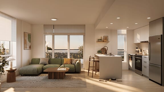 A modern kitchen with a large island and a view of the ocean.