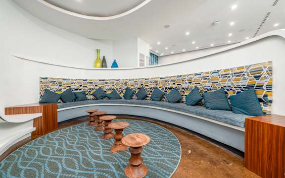 A living room with a blue and yellow patterned couch.