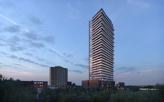 A tall building with a striped pattern is the focal point of the image.