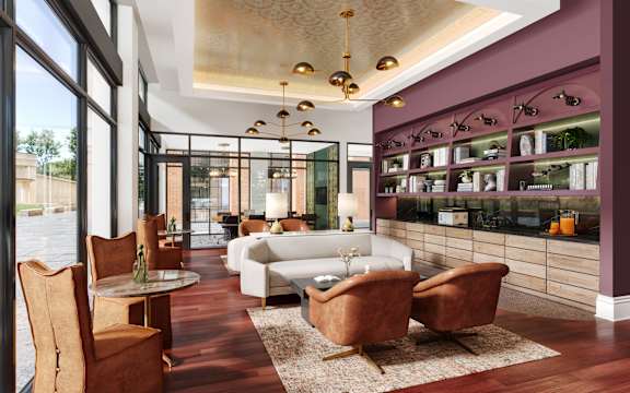 A modern living room with a white sofa and wooden chairs.