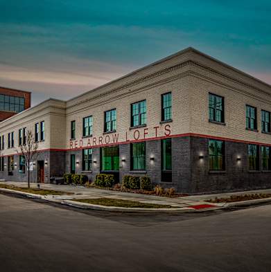 A building with the words Red Arrow Lofts on it.