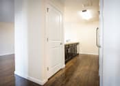 Thumbnail 10 of 11 - Hallway into kitchen and pantry