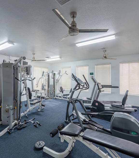 A well-equipped gym with various exercise machines at Cheyenne Villas, North Las Vegas, NV