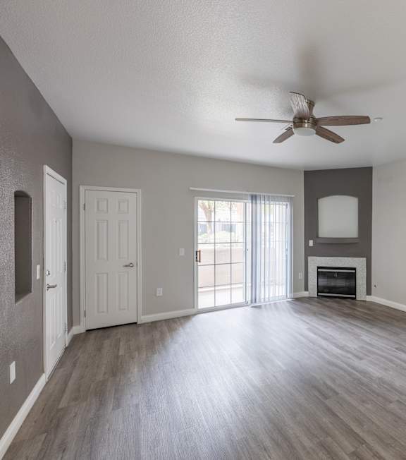 A spacious room with a ceiling fan and wooden flooring. at Cheyenne Villas, North Las Vegas, 89032