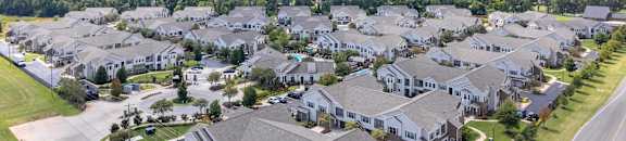 an aerial view of a large group of houses on a street at Kingston Crossing Apartment Homes, Bossier City, Louisiana