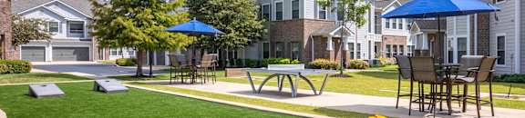 our apartments have a large yard with tables and umbrellas at Kingston Crossing Apartment Homes, Louisiana  , 71111