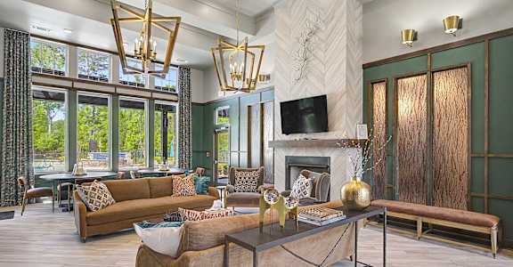 A living room with a fireplace and a television.