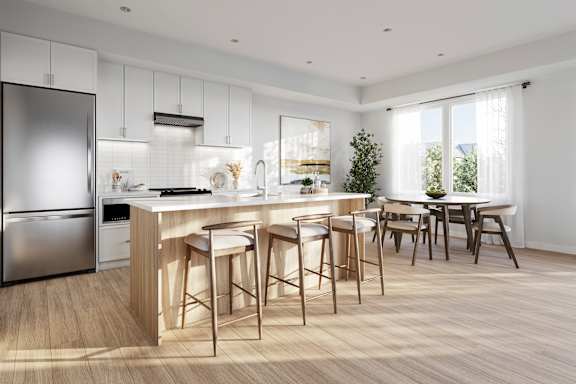 A modern kitchen with a bar area and a dining table.