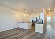 Thumbnail 3 of 8 - the preserve at ballantyne commons apartment living room and kitchen