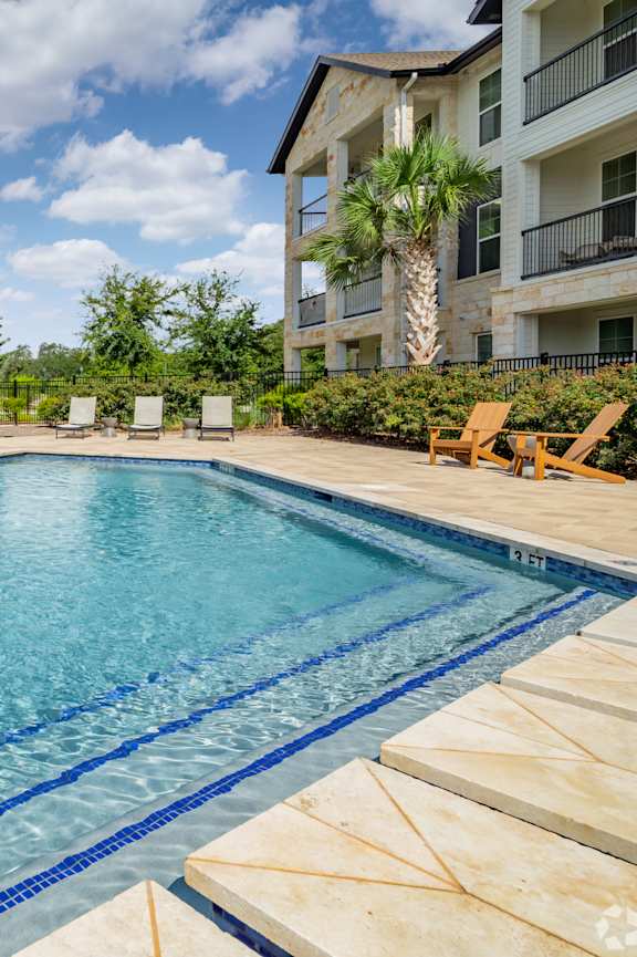 A large swimming pool in front of a building at Waterleaf at Neely Ferry Apartments, Simpsonville, SC 29680