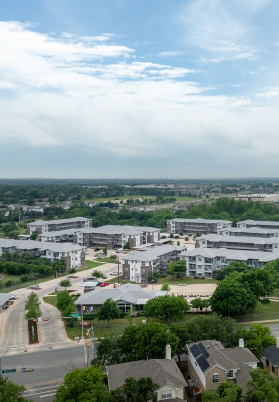 an aerial view of a neighborhood with houses and trees