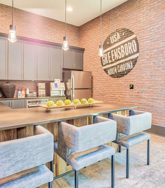 A kitchen with a brick wall and a sign that says "USA BREINSBORG".