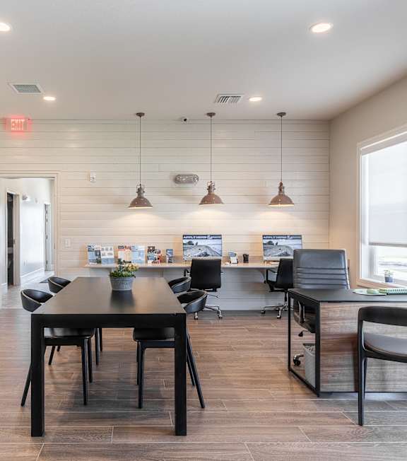 A modern kitchen with a dining table and chairs.