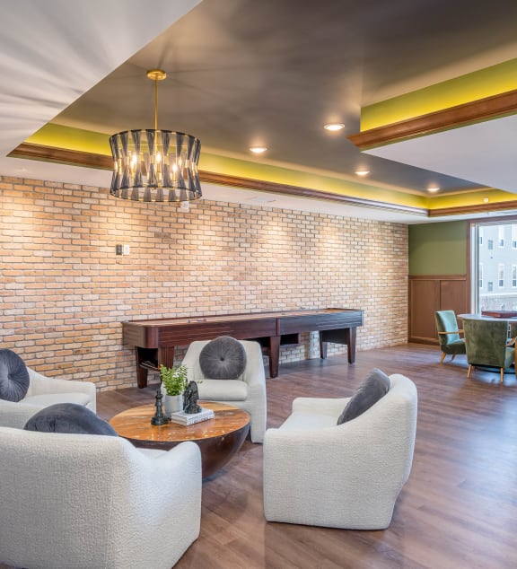 a dining room with a table and chairs and a sink