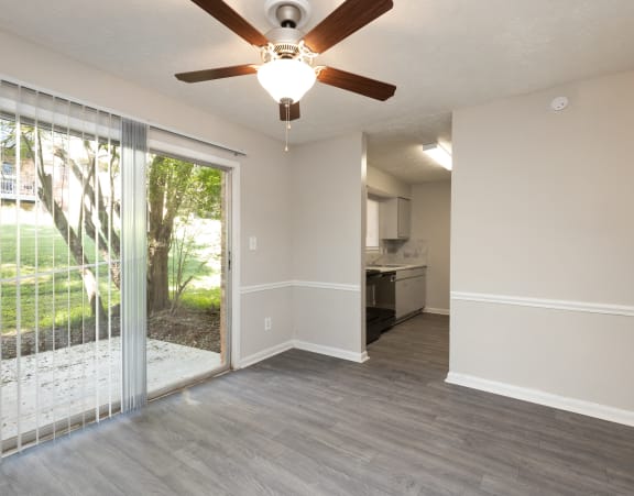 an empty living room with a ceiling fan and a sliding glass door at Hidden Woods, Decatur, GA, 30035