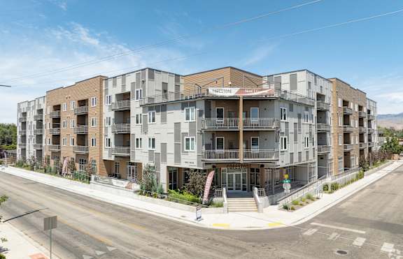 a rendering of an apartment building on a city street at Copestone, Garden City, 83714