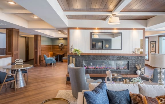 a living room with a fireplace and a chair