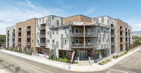 a rendering of an apartment building on a city street at Copestone, ID 83714